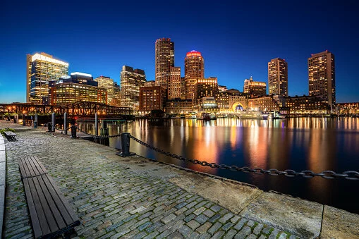 Boston Harbor and Financial District at night in Boston, Massachusetts, USA. 2021/10/gettyimages-1126648514-170667a.jpg 